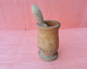Old antique prirmitive wooden mortar and pestle for spices or garlic
