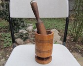 Old antique prirmitive wooden mortar and pestle for spices or garlic
