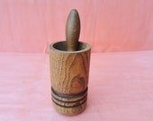 Old antique prirmitive wooden mortar and pestle for spices or garlic