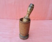 Old antique prirmitive wooden mortar and pestle for spices or garlic