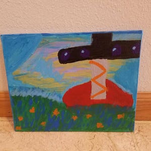 May include: A painting of a red and orange abstract shape with a black and purple shape above it. The background is blue with yellow and white brushstrokes. The painting is on a canvas.