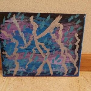 May include: Abstract painting on canvas with silver, blue, and purple paint. The painting features a series of lines and shapes that create a dynamic and energetic composition.