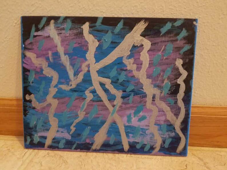 May include: Abstract painting on canvas with silver, blue, and purple paint. The painting features a series of lines and shapes that create a dynamic and energetic composition.
