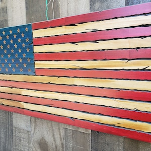 Tattered Red White and Blue American flag. Patriotic wooden flag