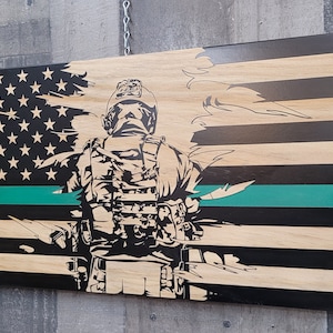 Soldier torn laser engraved green line wood American flag.