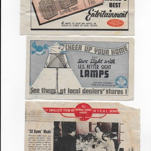 May include: Three vintage advertisements for home products. The top ad features a radio with the text "Your Ticket to the World's Best Entertainment". The middle ad features a lamp with the text "Cheer Up Your Home and Save Sight with L.E.S. Better Sight Lamps". The bottom ad features a family sitting around a table with the text "The Smallest Item of Average Family Budget is T.P. & L. Service" and "Sit Down Meals".