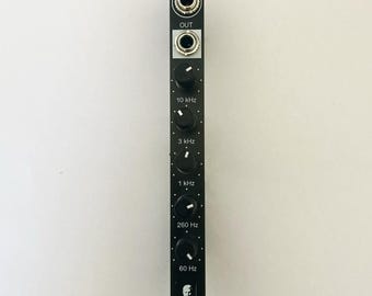 May include: Black modular synthesizer module with "IN" and "OUT" jacks, knobs labeled "10 kHz", "3 kHz", "1 kHz", "260 Hz", and "60 Hz". Features a small portrait and the letters "MM".