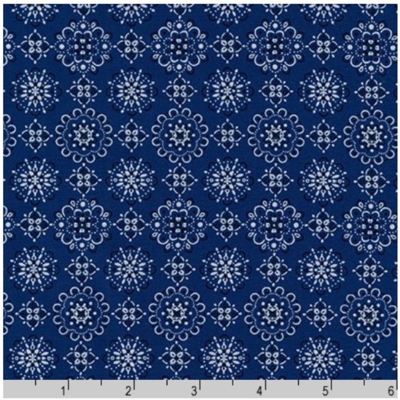 May include: A blue fabric with a white repeating pattern of stylized flowers. The pattern is a traditional bandana design.