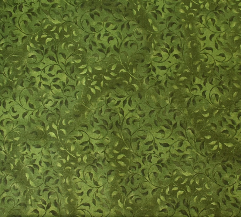 May include: Green fabric with a repeating pattern of dark green leaves and vines. The fabric has a subtle shimmer.