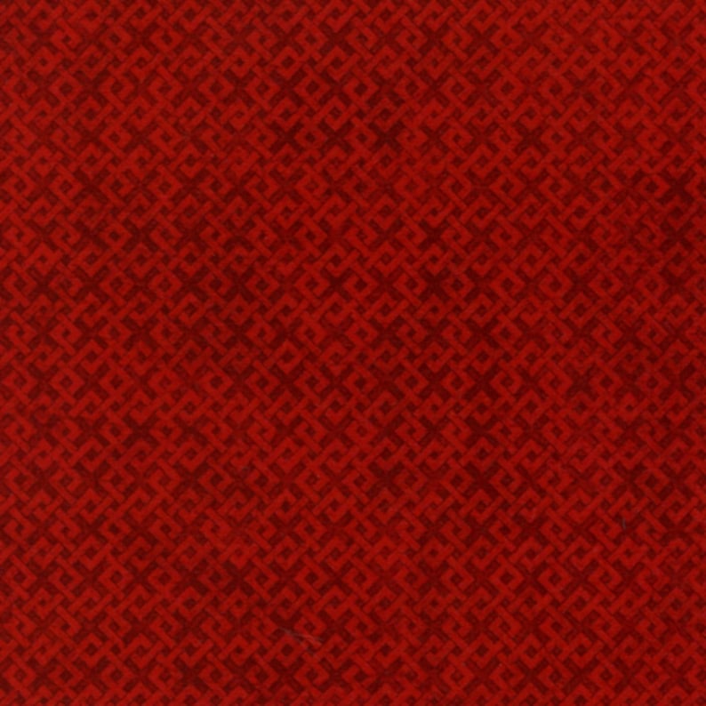 May include: Red fabric with a repeating geometric pattern of small squares and diamonds.