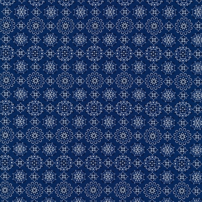 May include: A seamless pattern of white floral designs on a deep blue background. The pattern is made up of repeating geometric shapes and intricate details.