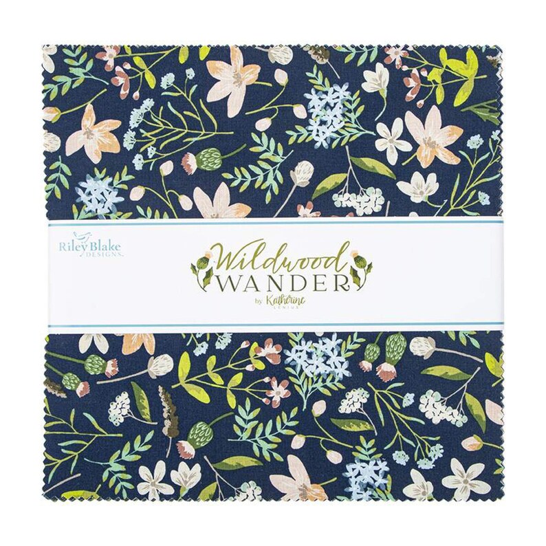 May include: A navy blue fabric square with a white label that reads "Wildwood Wander by Katherine  Englund". The fabric features a floral pattern with white, pink, and blue flowers and green leaves.