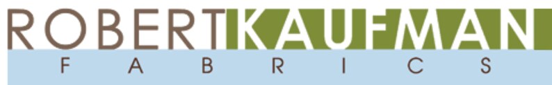 May include: A logo for Robert Kaufman Fabrics, featuring the company name in brown and green lettering with the word "Fabrics" in brown lettering below.