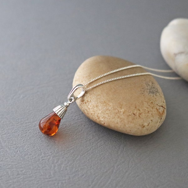 Small drop pendant with amber on 925 silver chain