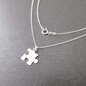 Puzzle necklace with small pendant and chain in 925 silver