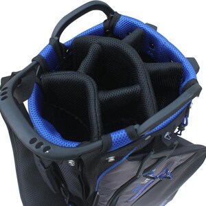 May include: Black and gray golf bag with blue accents. The bag has multiple compartments for clubs and accessories. Features a sturdy handle and a blue mesh lining around the top opening. The bag is designed for easy carrying and organization on the golf course.