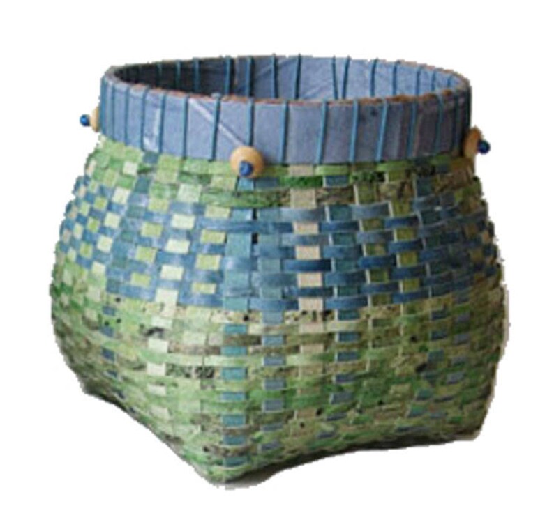 May include: A woven basket with a blue and green checkered pattern. The basket has a blue rim with wooden beads around the top.