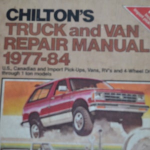 May include: A vintage CHILTON'S TRUCK and VAN REPAIR MANUAL cover from 1977-84. The cover features a red pickup truck with a white stripe and a white background.