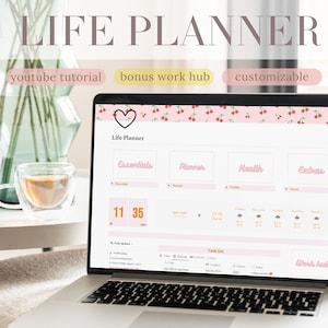 May include: A laptop computer displaying a customizable life planner with a cherry pattern background. The planner is divided into sections for essentials, planner, health, and extras. The laptop is on a table with a cup of tea and a vase of flowers.