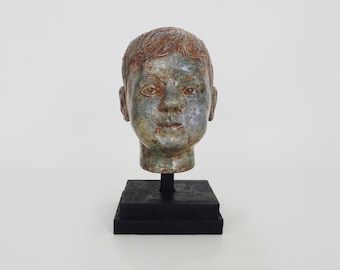 Sculpture of a child's face in glazed sandstone, Italian sculptor. 70s 80s