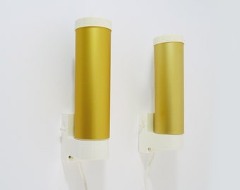 Pair of vintage ERCO 3023 wall lights. Germany. Wall lamp in gold metal, glass and white plastic. Space age