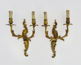 Old pair of double-light wall sconces in bronze or brass, acanthus leaf.