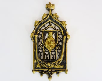 Old large cast iron door knocker in the shape of a church facade, blank knocker. Religious door knocker