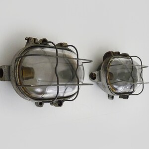 Pair of cast iron industrial porthole wall lights. Industrial wall lights.