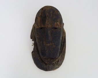 Old Dogon mask from Mali in wood. African mask