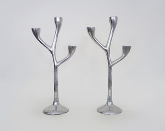 Pair of Italian "Tree" candlesticks in cast aluminum from the 80s
