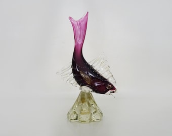 Red and clear Murano glass fish.
