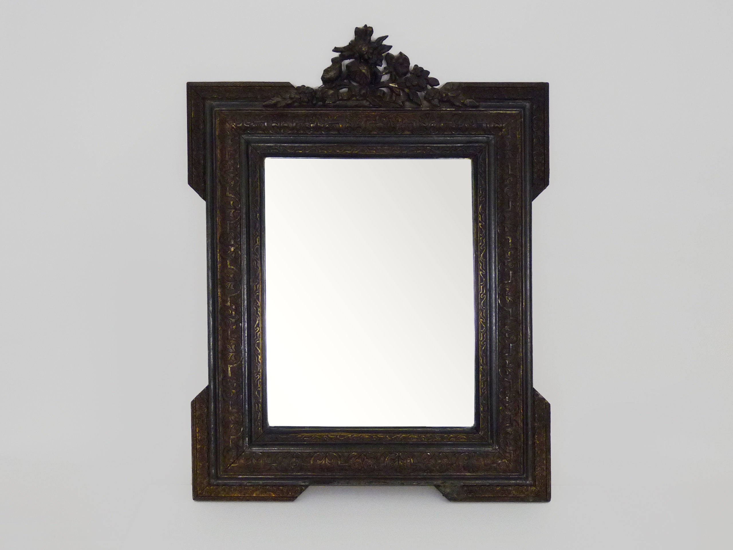 Old Mirror With Pediment in Wood and Black and Gold Stucco image