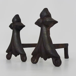 Pair of cast iron fireplace andirons. France, 19th century.