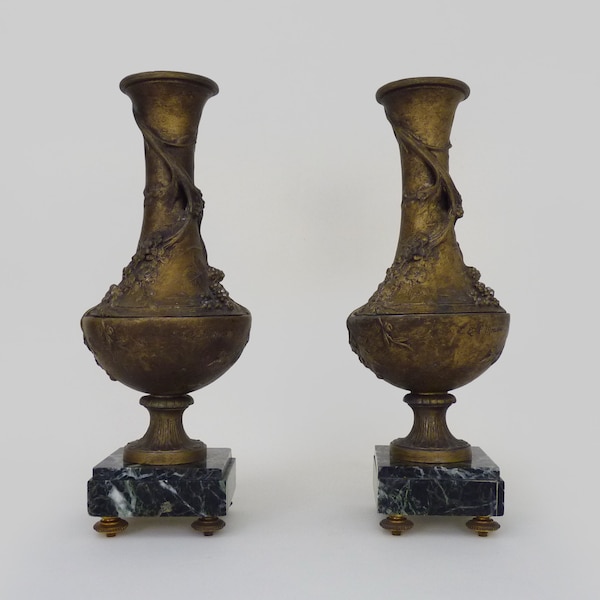 Pair of spelter vases on a marble base signed L and F Moreau