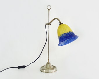 Art deco desk lamp with chromed metal slide and yellow and blue glass tulip.