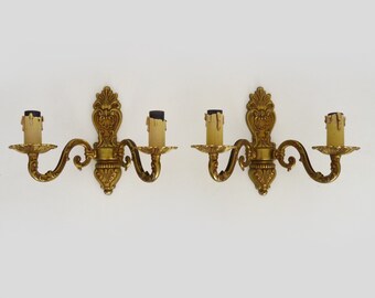 Old pair of bronze double-light wall sconces