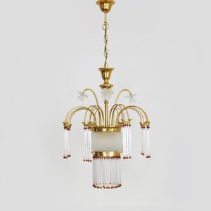 Art Nouveau style chandelier in brass with pendants and glass globe with 3 lights. Italy 70s 80s