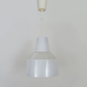 Vintage industrial pendant light in glass and metal rod, factory, workshop, garage