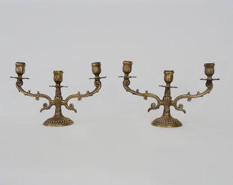 Pair of old bronze candlesticks with 3 branches