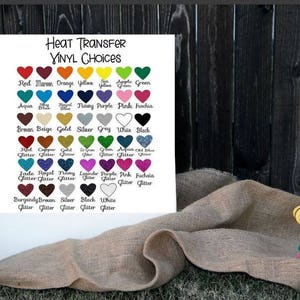 May include: A chart with a variety of heat transfer vinyl colors, including red, orange, yellow, green, blue, purple, pink, brown, beige, gold, silver, gray, white, and black. The chart also includes the word "Glitter" next to many of the colors.