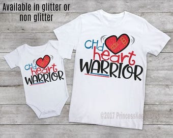 May include: Two white t-shirts with the text "Child heart warrior" and a red heart with a bandage on it. The larger shirt has the text "©2017 PrincessKes"