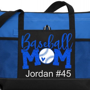 May include: Blue and black tote bag with a mesh pocket. The bag has a white design that says "Baseball Mom" with a baseball and heart graphic. The text "Jordan #45" is also included in the design.