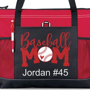 May include: Red and black tote bag with a mesh pocket. The front pocket has a red glitter design that says "Baseball Mom" with a baseball and a heart. The text "Jordan #45" is below the design.