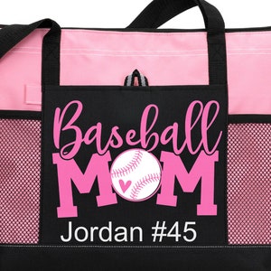 May include: Pink and black tote bag with a mesh pocket. The bag has a pink baseball with a heart on it and the text "Baseball Mom Jordan #45".