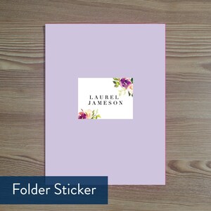 May include: A lavender folder sticker with a white label and floral design. The label says "LAUREL JAMESON".