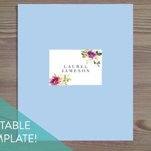 May include: A light blue printable template with a white box featuring a watercolor floral design and the text "LAUREL JAMESON".