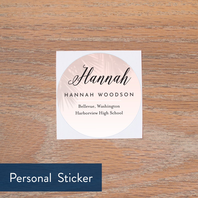 May include: A white round sticker with a pink palm leaf design. The sticker says "Hannah Hannah Woodson Bellevue, Washington Harborview High School" in black text.
