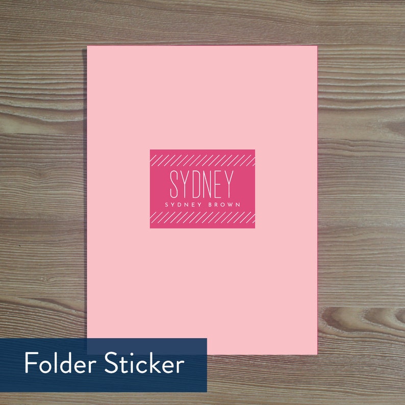 May include: Pink folder sticker with a red square and white text that says "Sydney" and "Sydney Brown" in a modern font.