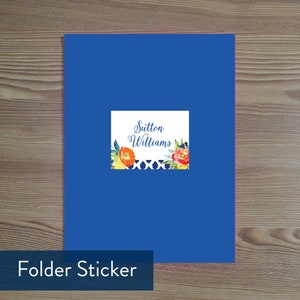 May include: A blue folder sticker with a white label that says "Sutton Williams" and a floral design with orange, yellow, and blue flowers.