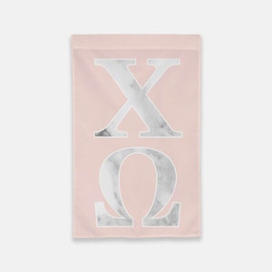 May include: A pink garden flag with the letters "XΩ" in white with a marble pattern.